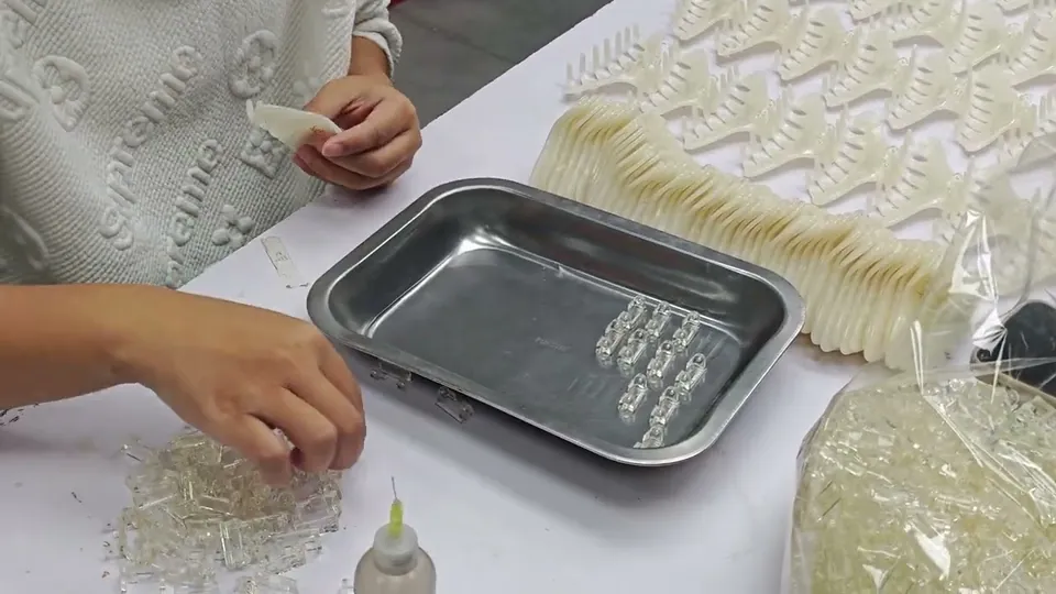 Bonding claw components by hand