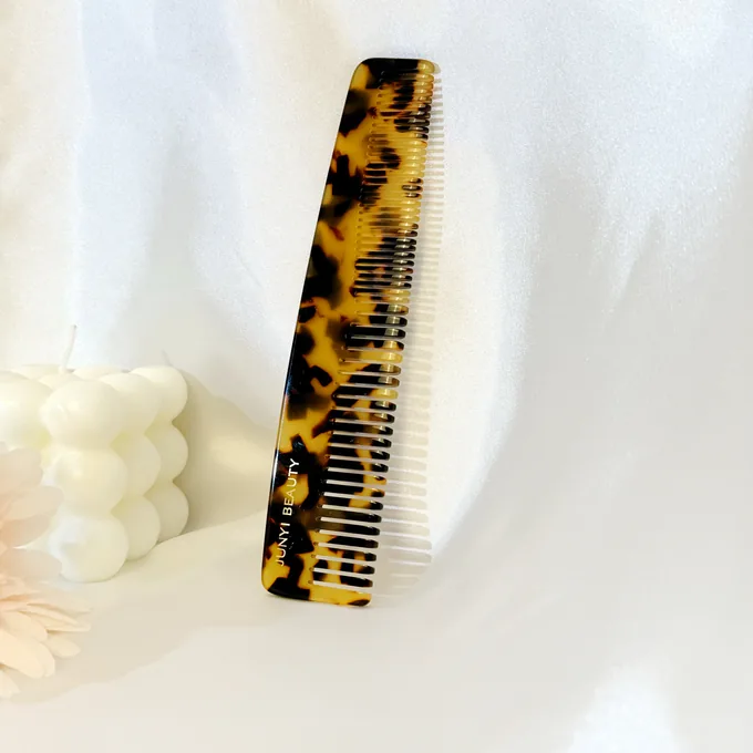 Tortoiseshell cellulose acetate dressing comb material close-up