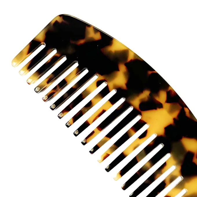 Acetate curved dual-tooth comb showing wide teeth and fine teeth in tortoiseshell