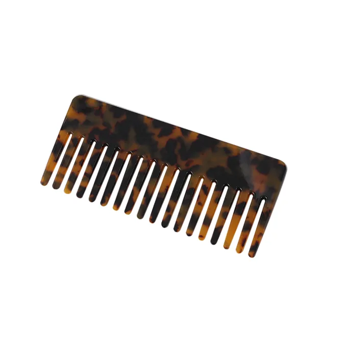 Close-up of the wide teeth on a tortoiseshell acetate comb