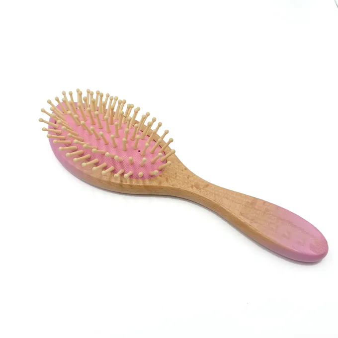 Pink colourway of the bamboo cushion hair brush with wooden pins