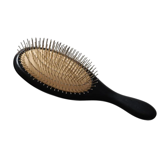 Stainless steel pins set into the gold air-cushion pad of the oval brush