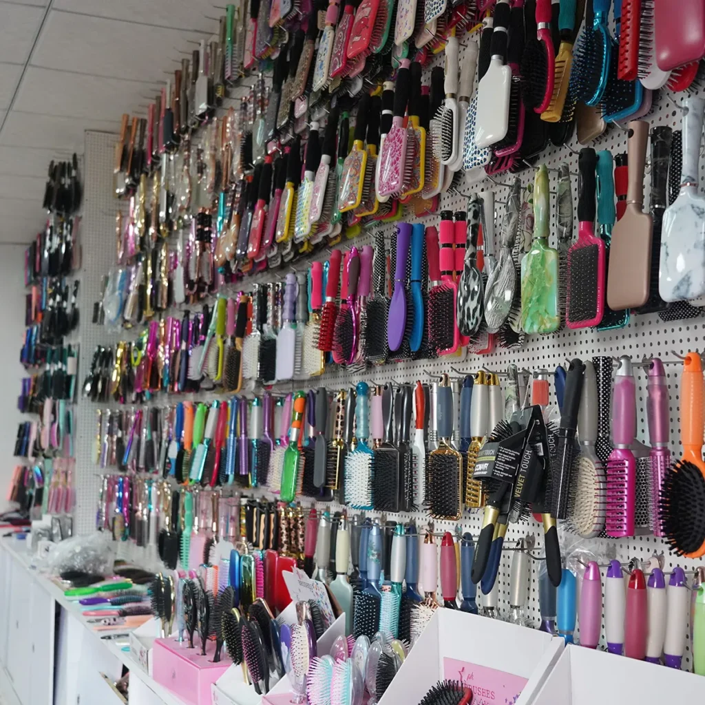 Showroom displaying hair brush, comb and clip samples across materials