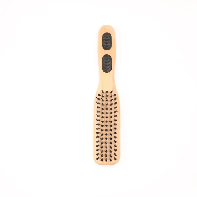Slim styling brush shown top-down, a narrow bristle field for precise styling