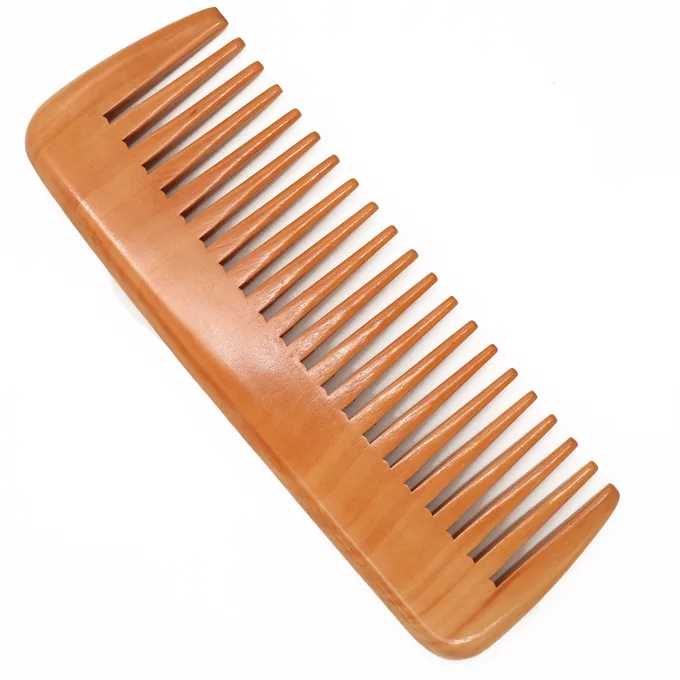 Handle-free wooden pocket comb with a smooth flat spine for laser engraving