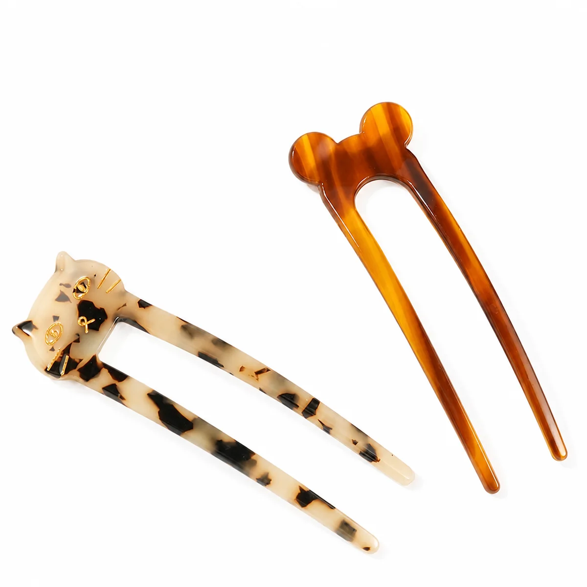 Two acetate hair forks with a leopard cat head and an amber ball head