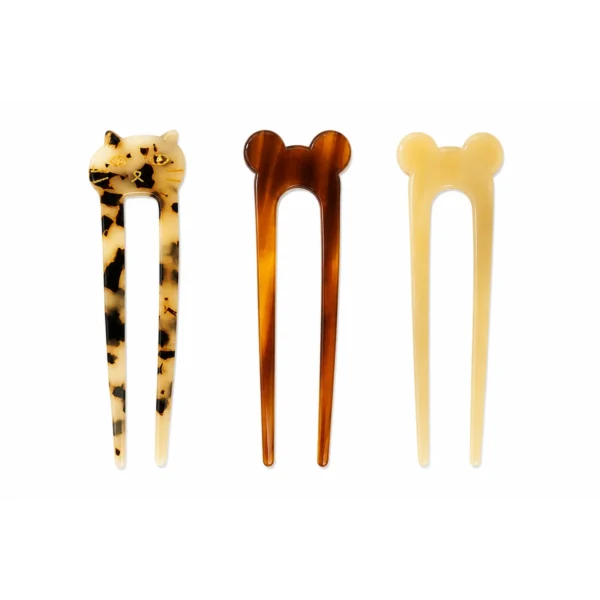 Three animal-top acetate hair forks upright: leopard cat, brown ball and cream ball