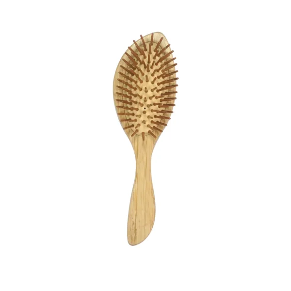Bamboo cushion hair brush standing upright, showing the full oval field of turned wooden pins on the natural rubber cushion above a shaped bamboo handle