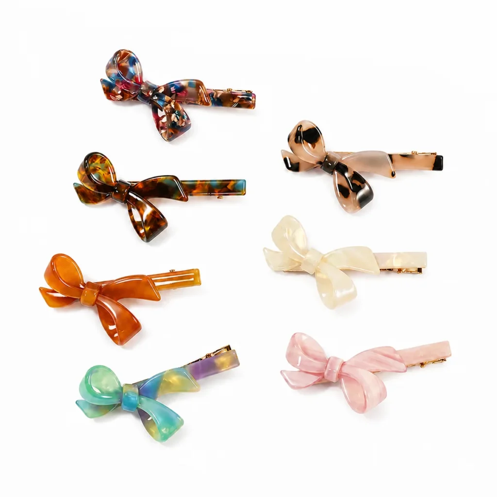 Six acetate bow clips in a grid showing every colourway