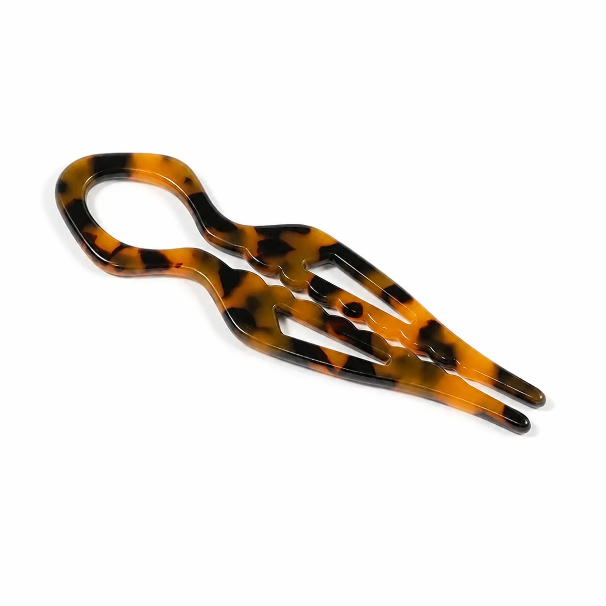 Single carved tortoiseshell hair fork, cut-out pattern through the shank