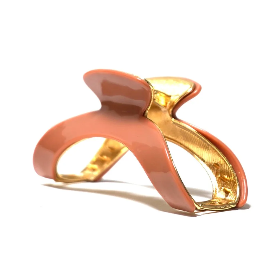 Coral acetate claw clip on a gold-plated metal frame