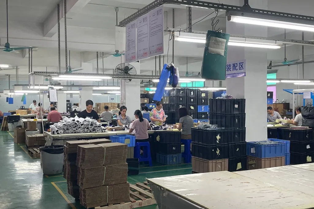 Hair accessory production line with workers at stations