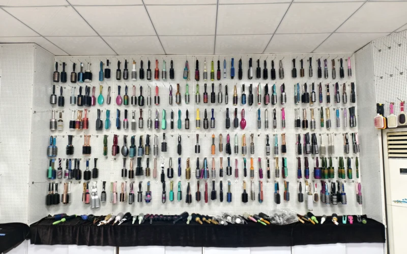 Sample room wall in our factory displaying several hundred hair brush and comb styles