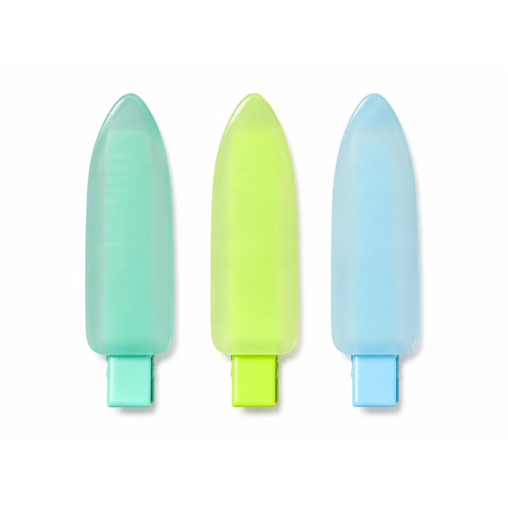 Three frosted semi-translucent acetate duckbill clips standing upright on white in mint, lime and pale blue, each with the spring base coated to match the body