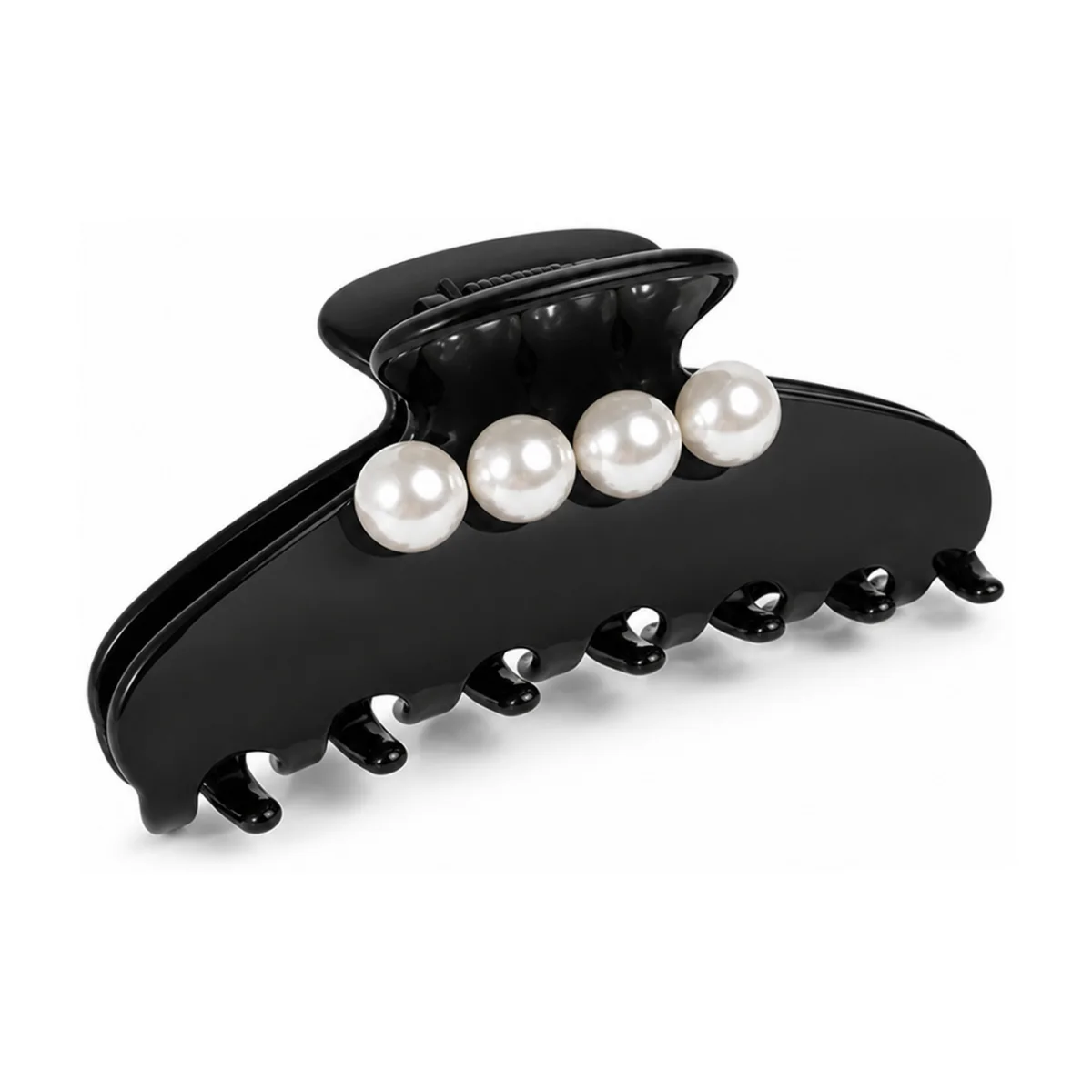 Gloss black acetate claw clip set with a row of four large round pearls, the pearls reading bright against the black sheet