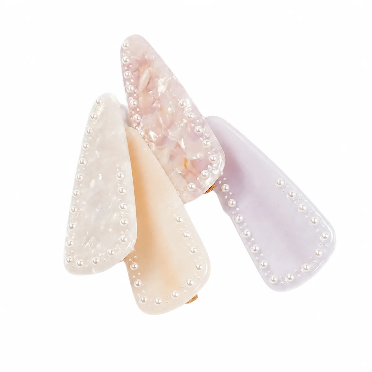 Four pearl-edged acetate hair clips overlapping, pearl beading along each edge