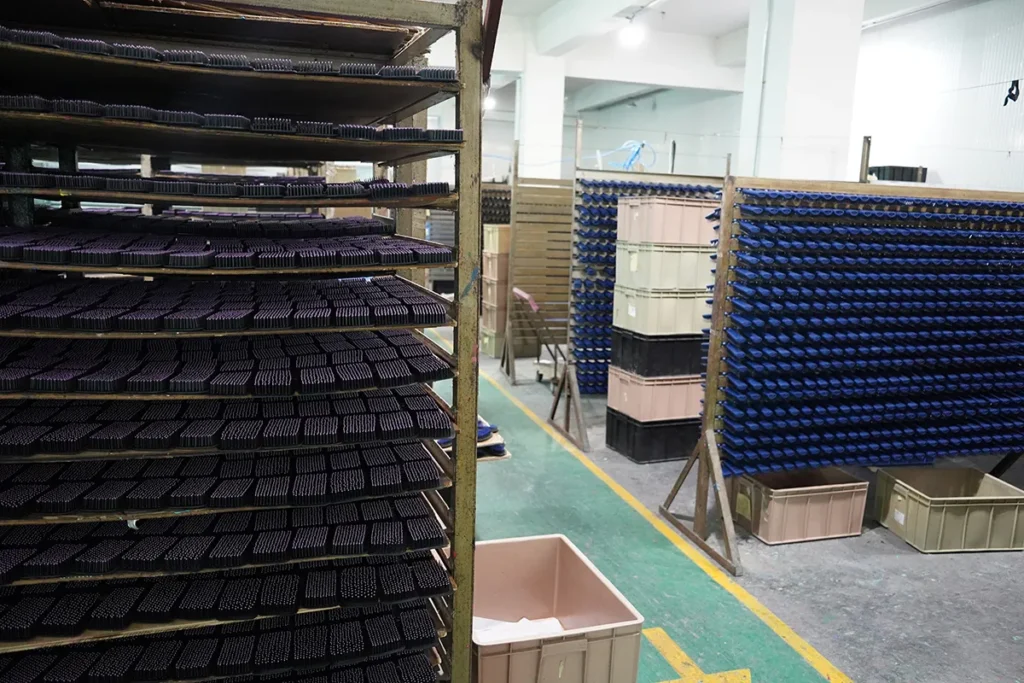 Production drying racks holding hair accessory components