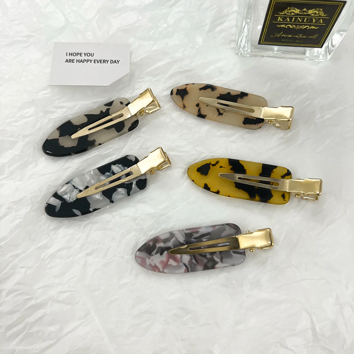 Five tortoiseshell duckbill clip colourways shown together