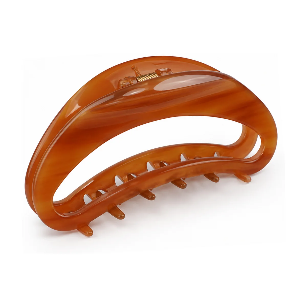 Amber tortoiseshell acetate claw clip cut as an open crescent, the hollow centre showing how the frame carries the spring load