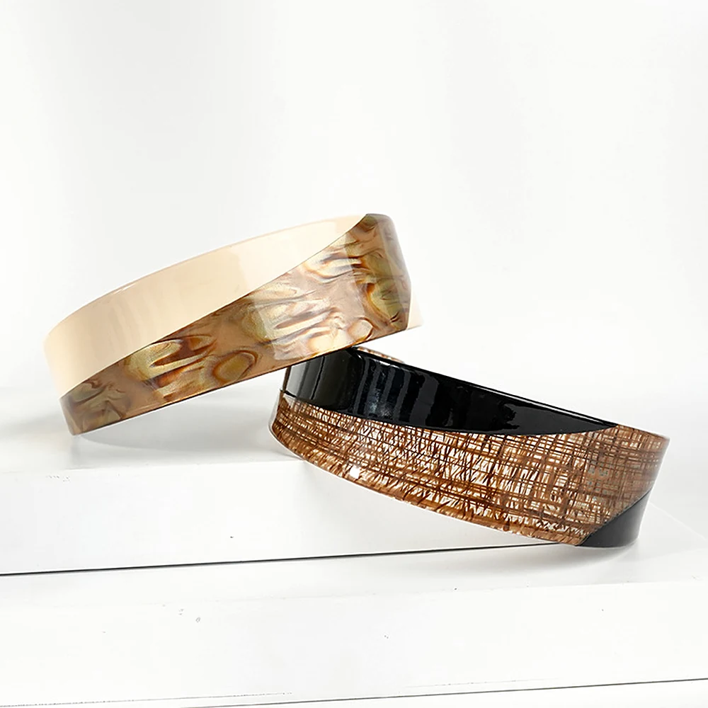 Two colourways of the colour-block acetate headband