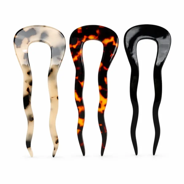 Three wavy-prong hair forks upright in cream leopard, amber tortoiseshell and black