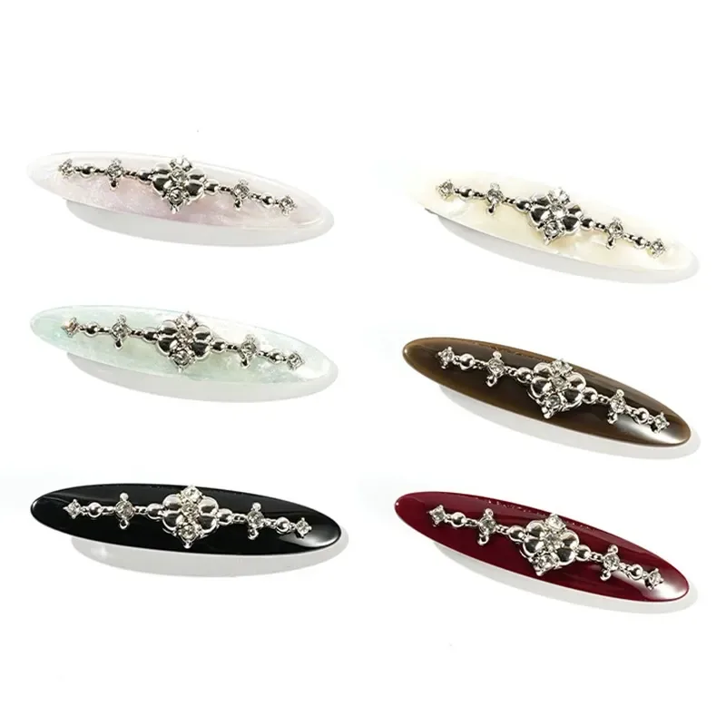 Six willow-leaf acetate barrettes with crystal motif in all colourways