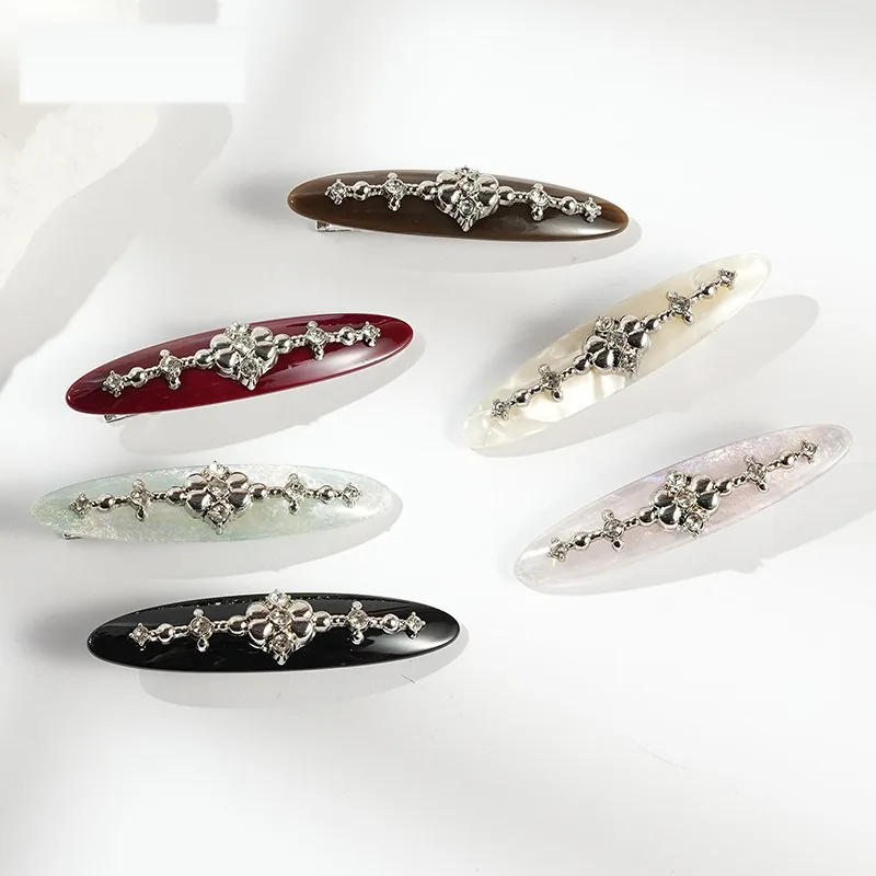 Five willow-leaf crystal barrettes in the full colour range
