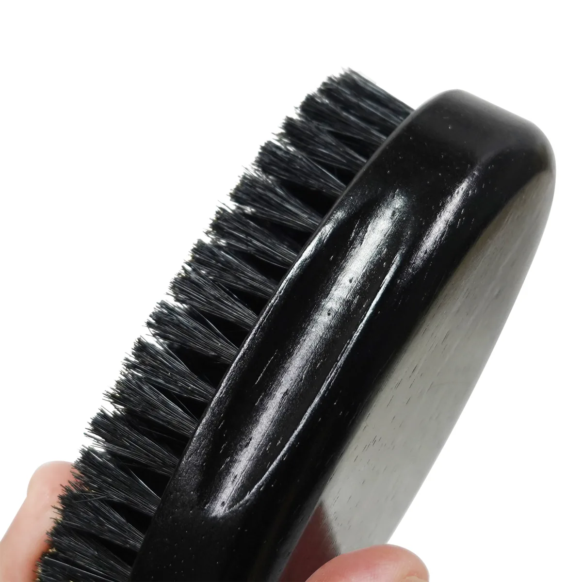 Close-up of the boar bristle field on a wooden beard brush