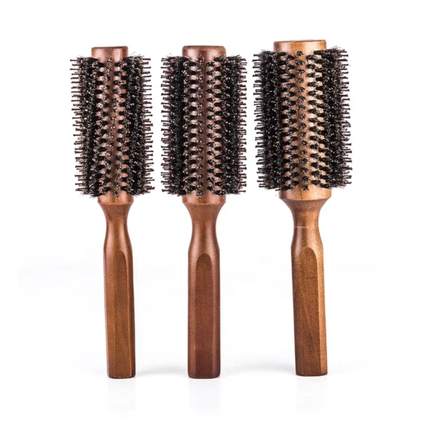 Three wooden round blow-dry brushes upright side by side in three barrel diameters