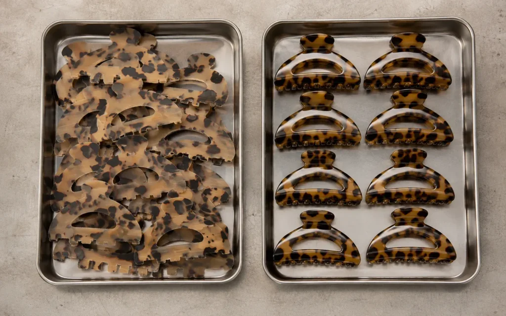 Two trays comparing rough cut acetate blanks with tumbled and polished finished clips