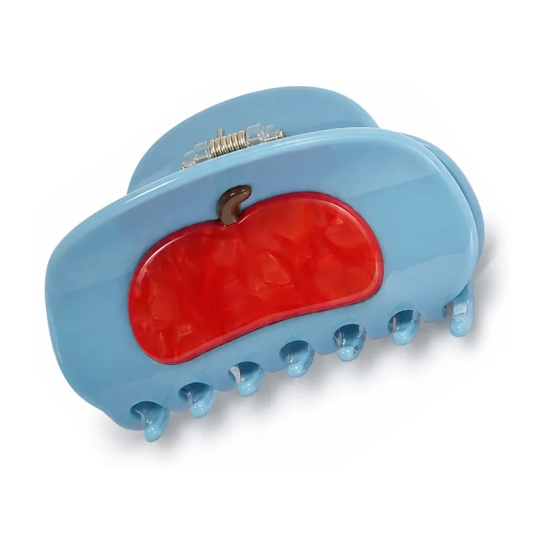 Sky blue acetate claw clip with a red apple inlaid on the face