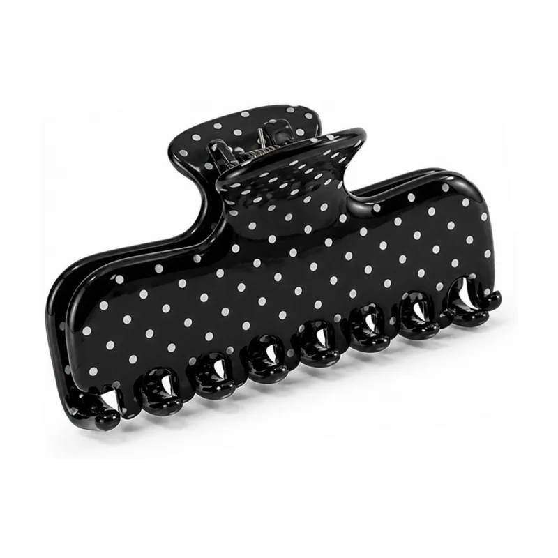 Black acetate banana claw clip printed with white polka dots