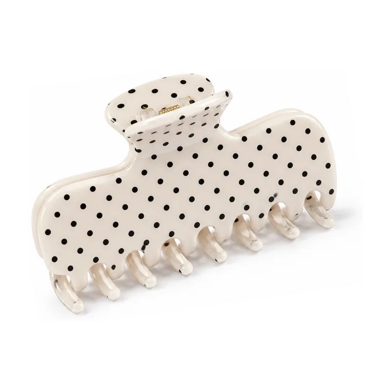 Ivory acetate banana claw clip printed with black polka dots