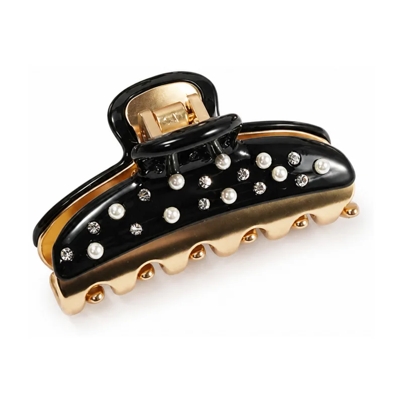 Gloss black acetate mini claw clip set with pearls over gold rope teeth