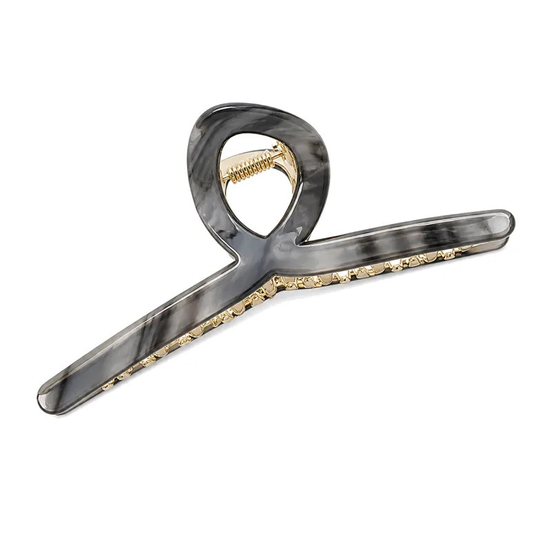 Grey marble acetate loop claw clip edged with a gold chain trim