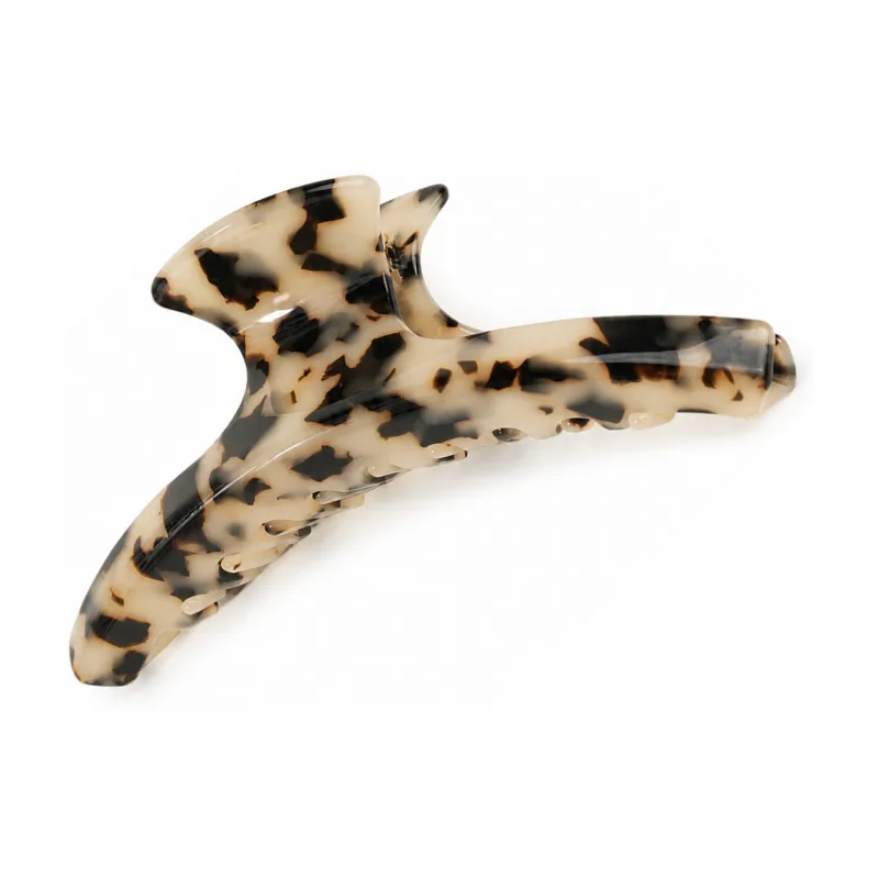 Blonde tortoiseshell acetate banana claw clip with a hooked upper arm