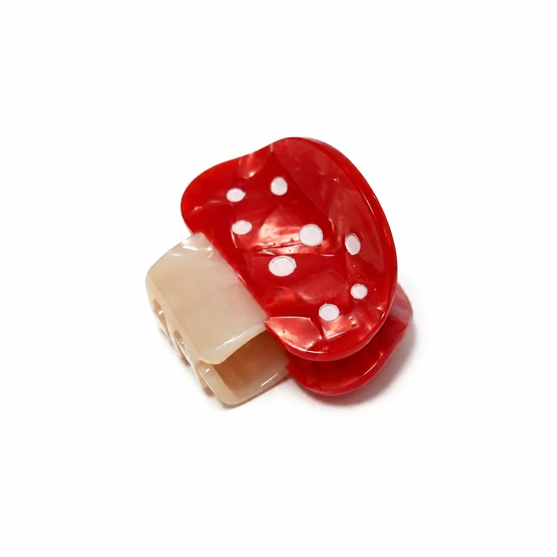 Red and ivory acetate mini claw clip shaped as a spotted mushroom