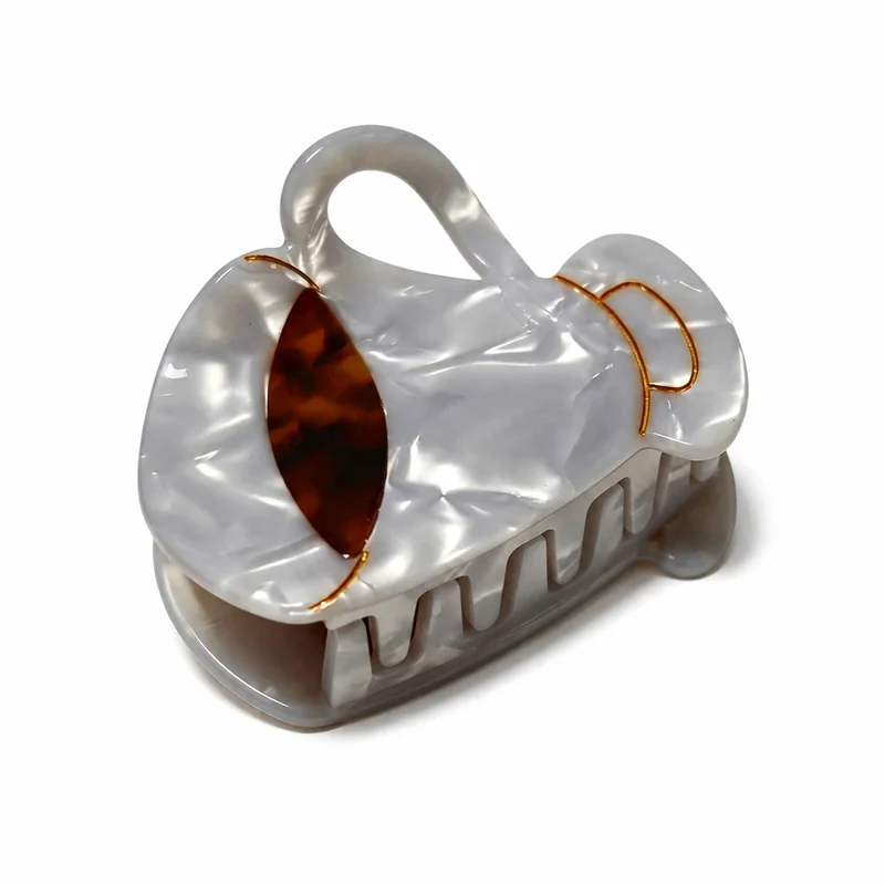 Pearl acetate sculptural loop claw clip with gold line and tortoiseshell inlay