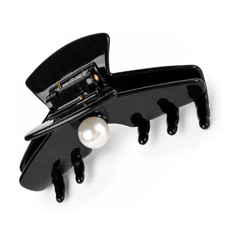 Gloss black acetate claw clip with a single large pearl at the hinge